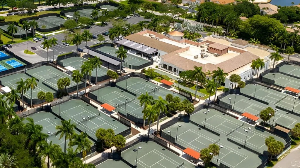 Aerial view of Broken Sound Club in Boca Raton featuring luxury homes, golf course, and Har-Tru tennis courts