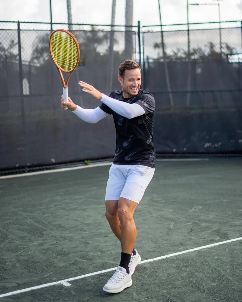 Tennis player on a Har-Tru court at Addison Reserve Country Club in Delray Beach