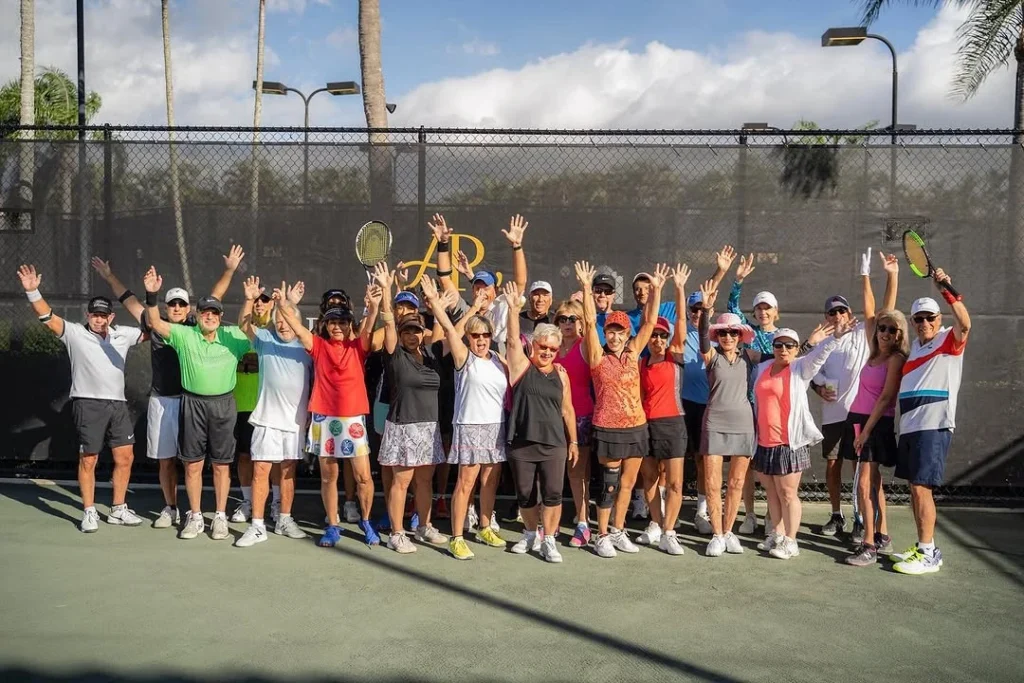 Residents participating in a tennis social event at Addison Reserve Country Club in Delray Beach