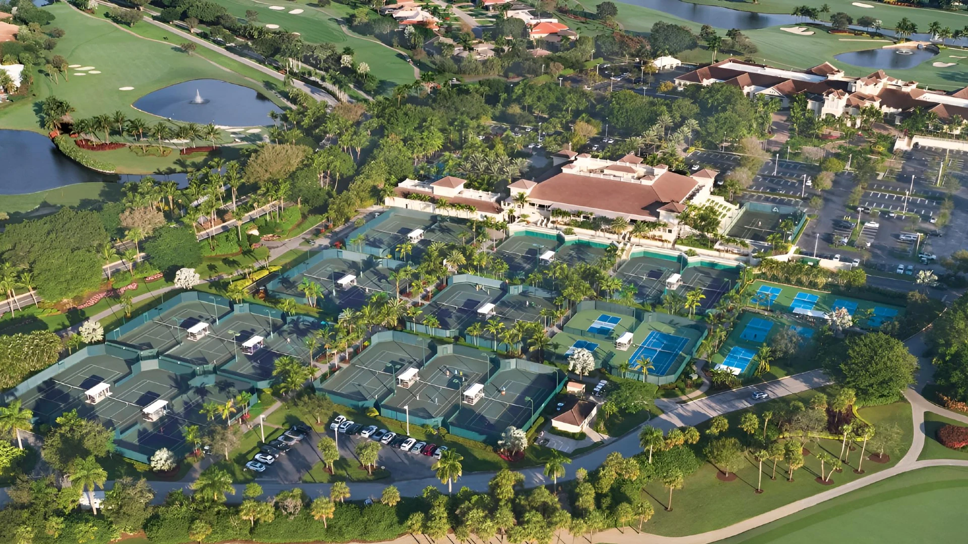 Aerial view of the BallenIsles Country Club tennis center and clubhouse in Palm Beach Gardens, Florida