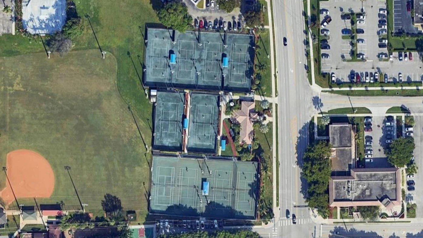 Aerial view of Boca Raton Tennis Center showing public clay and hard tennis courts in downtown Boca Raton Florida