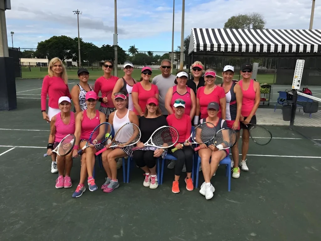Adult tennis players participating in a clinic at Boca Raton Tennis Center
