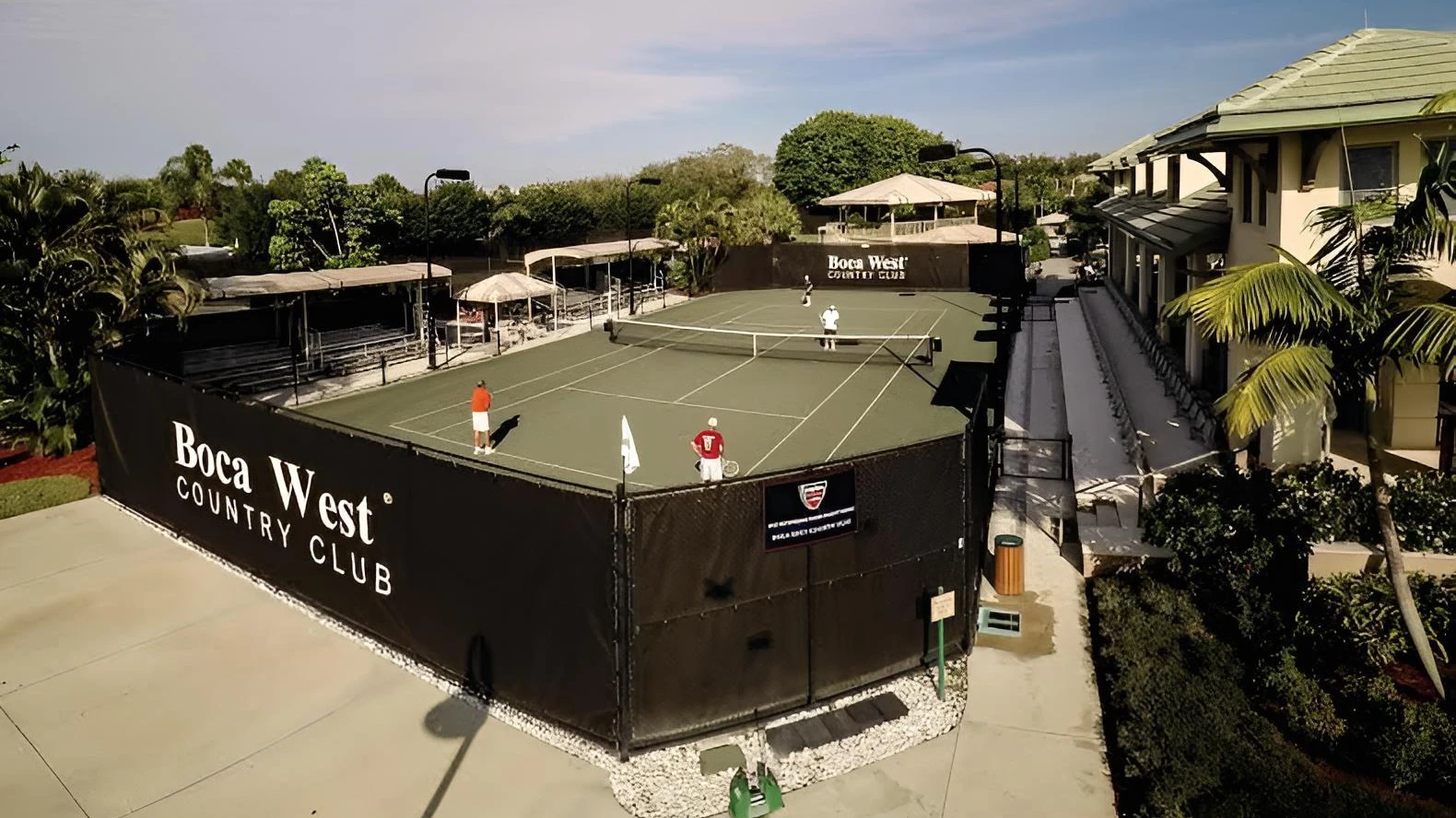 Tennis courts and clubhouse at Boca West Country Club in Boca Raton Florida
