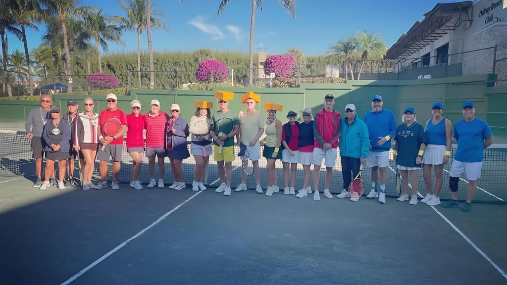 Members gathering for a tennis event on the Har-Tru courts at Delray Beach Club