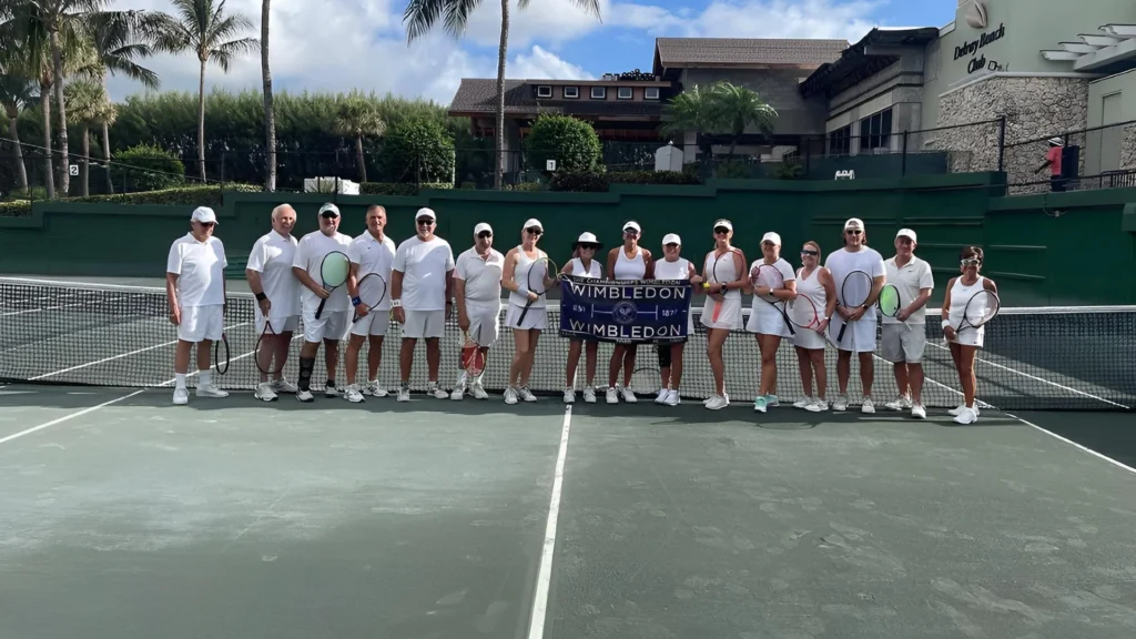 Members participating in a Wimbledon-themed tennis social event at Delray Beach Club in Delray Beach Florida