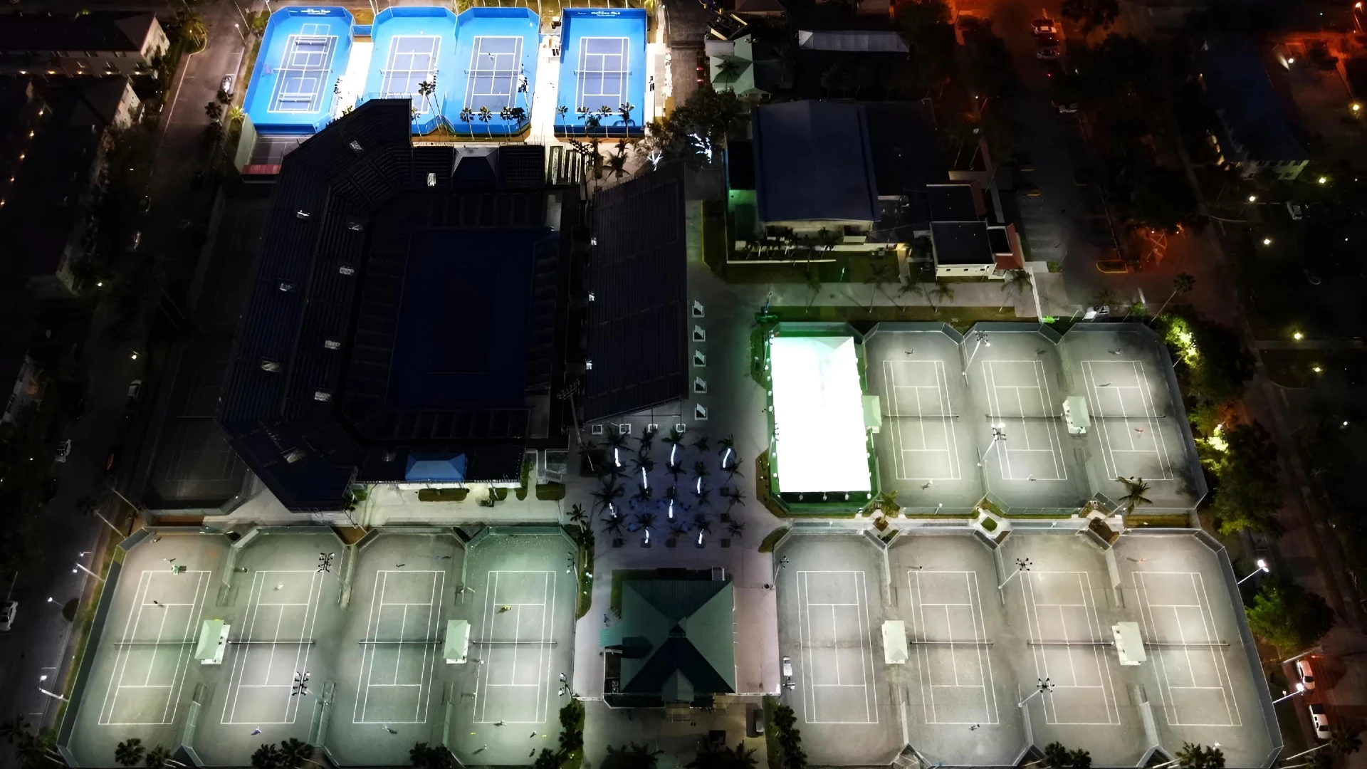 Night aerial view of Delray Beach Tennis Center showing clay courts, stadium court, and tennis facilities in Delray Beach Florida