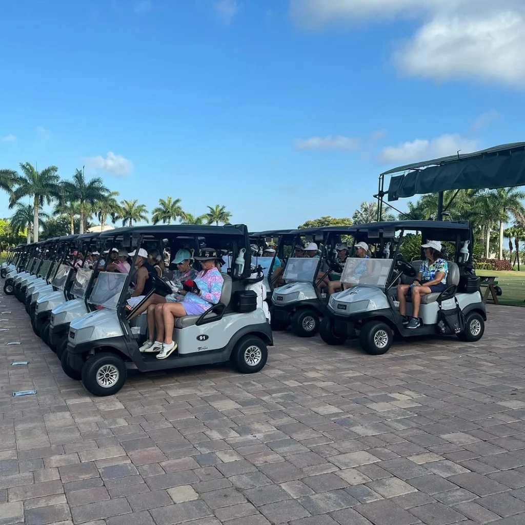 Residents gathering with golf carts at Gleneagles Country Club in Delray Beach