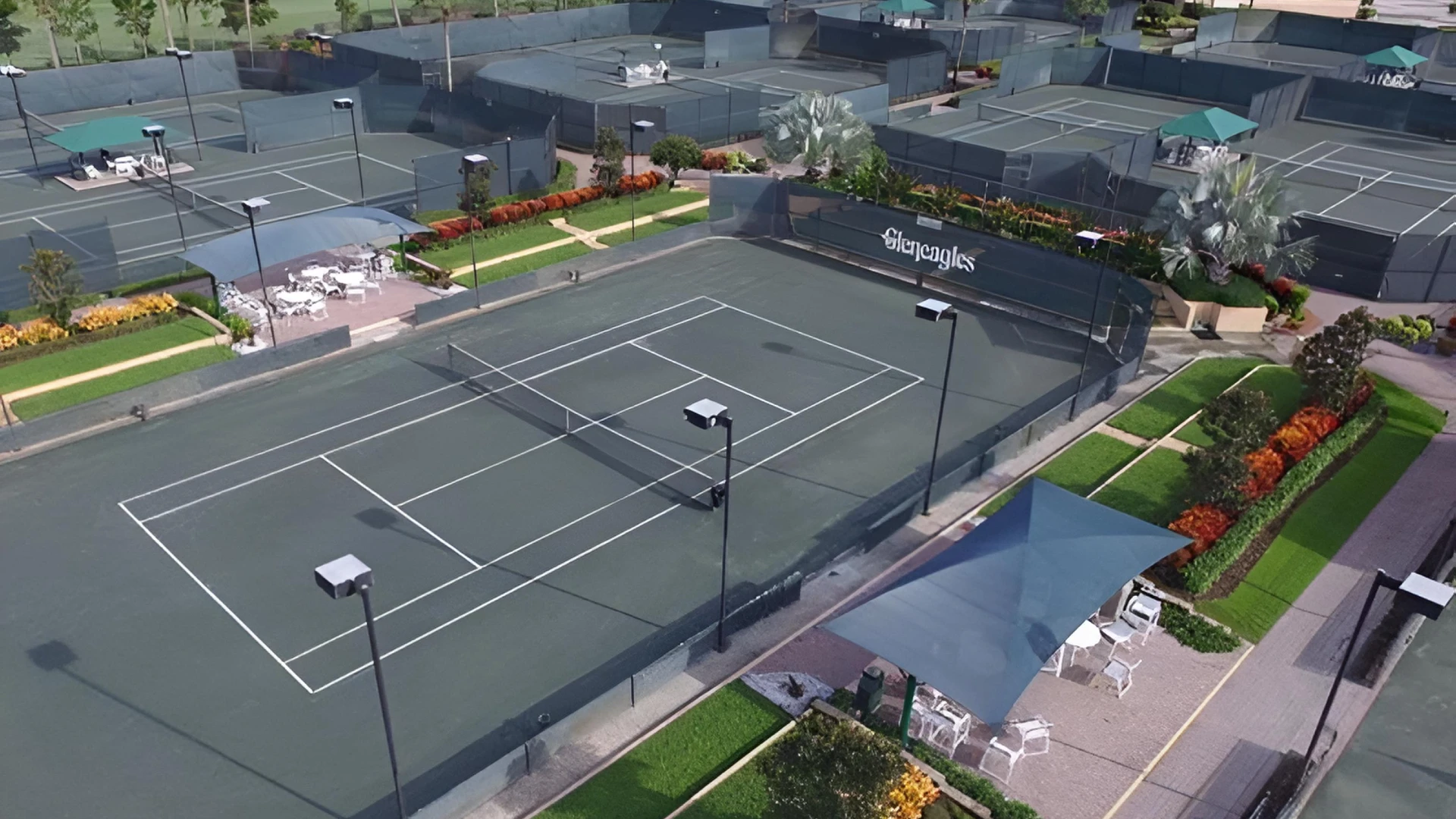 Aerial view of the Gleneagles Country Club tennis center in Delray Beach featuring Har-Tru tennis courts and landscaped club amenities