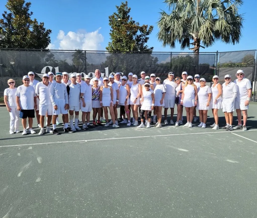 Residents participating in a themed tennis social event at Gleneagles Country Club in Delray Beach