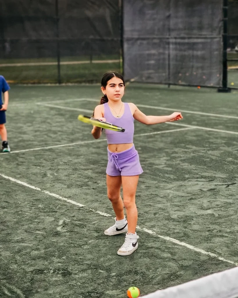 Young tennis player participating in the junior tennis program at Hunter’s Run Country Club in Boynton Beach