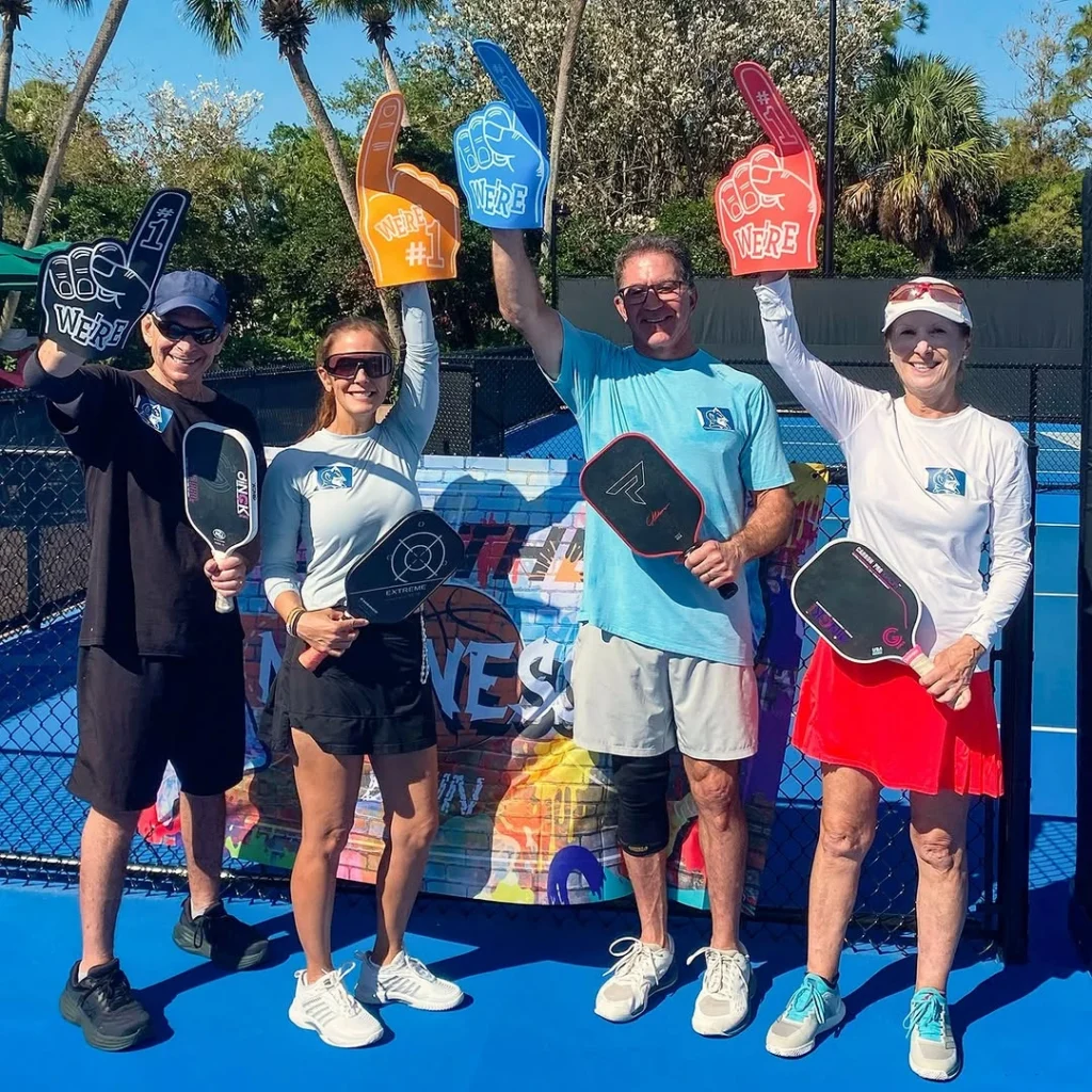 Residents participating in a pickleball social event at The Club at Mirasol in Palm Beach Gardens Florida