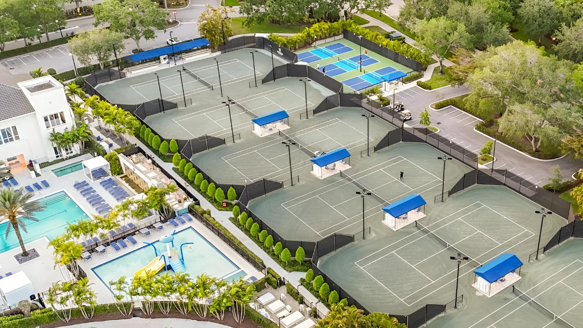 Aerial view of the Mizner Country Club tennis center in Delray Beach featuring Har-Tru tennis courts, pickleball courts, and resort style pool amenities