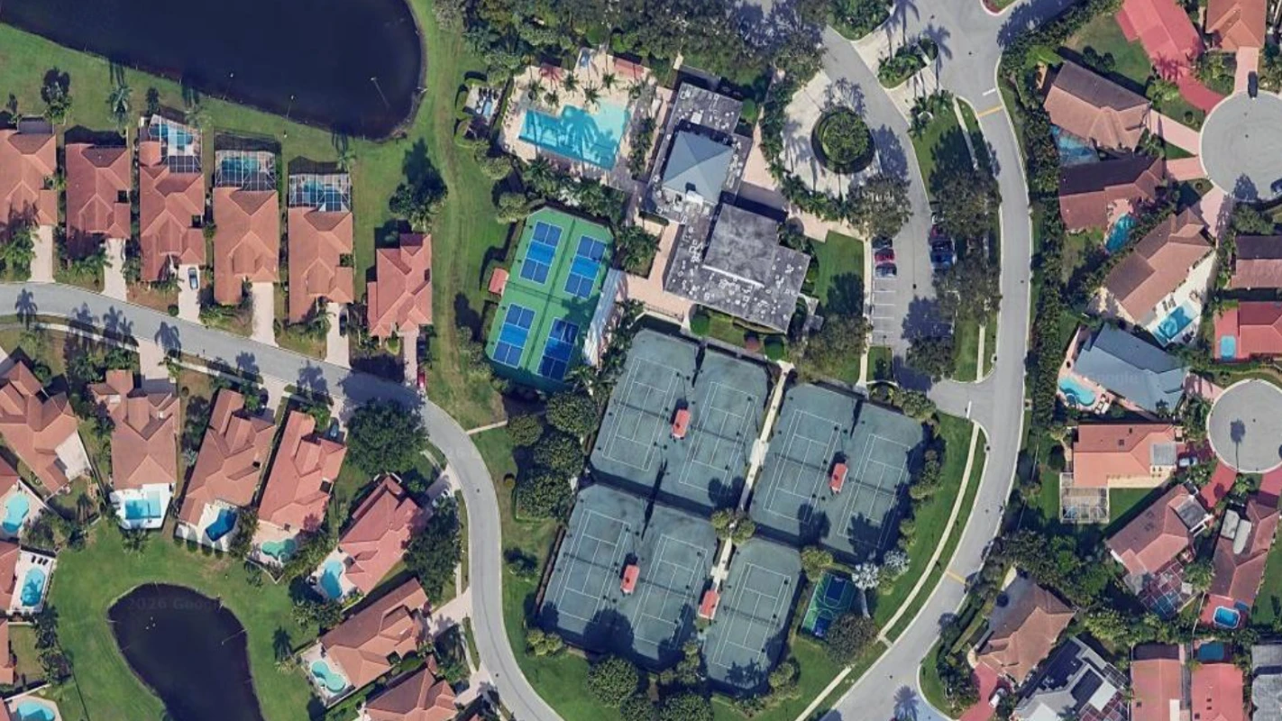 Newport Bay Club Tennis Center featuring Har-Tru tennis courts, pickleball courts, and clubhouse amenities in Boca Raton Florida