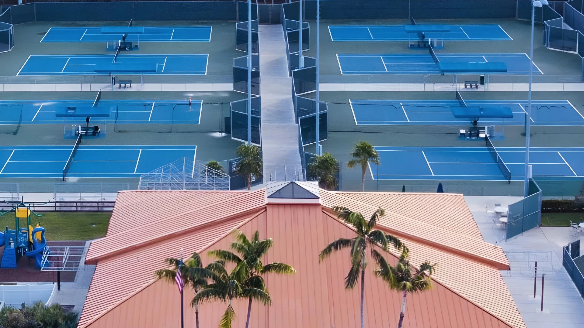 Aerial view of Patch Reef Paddle and Racquet Club showing hard tennis courts and clubhouse in Boca Raton Florida