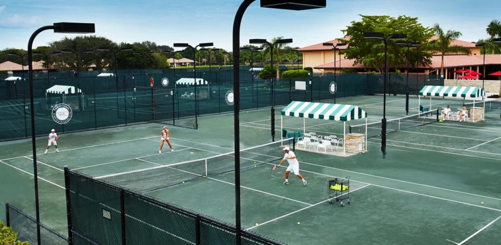 Tennis players taking a lesson at PGA National Sports & Racquet Club