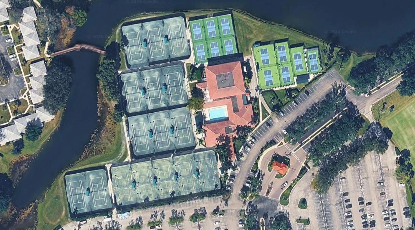 Aerial view of PGA National Sports & Racquet Club tennis and pickleball facilities in Palm Beach Gardens