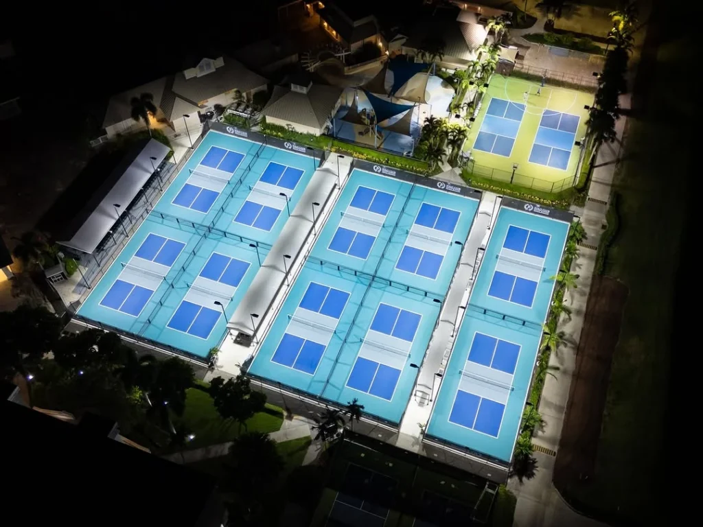 Aerial view of illuminated pickleball courts at Polo Club Boca Raton