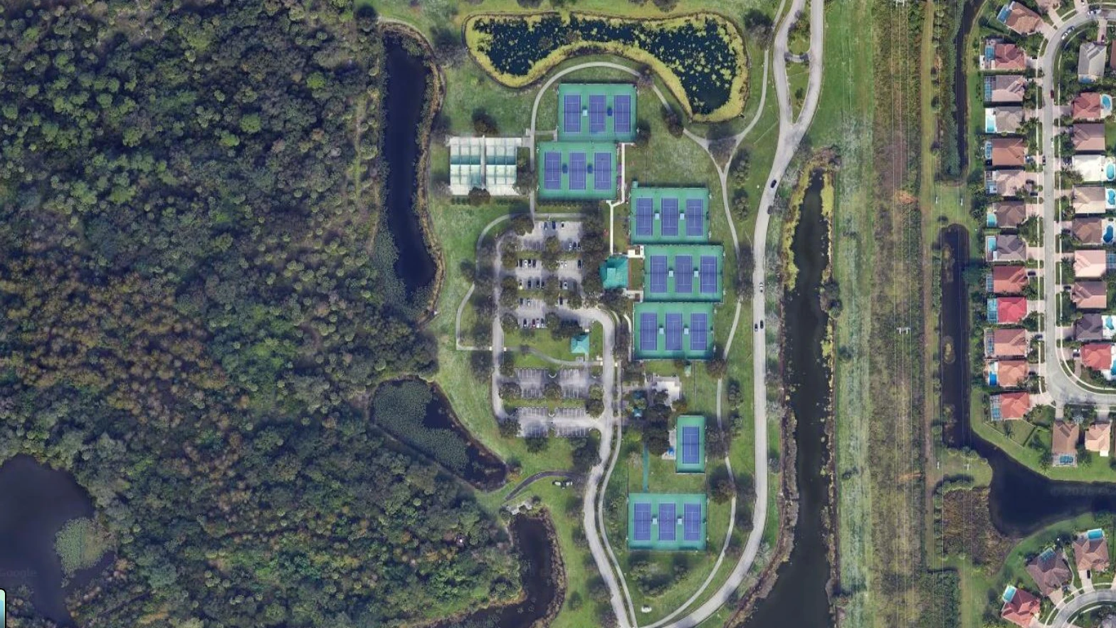 Aerial view of South County Regional Park Tennis Center in West Boca Raton featuring public tennis courts and training facilities