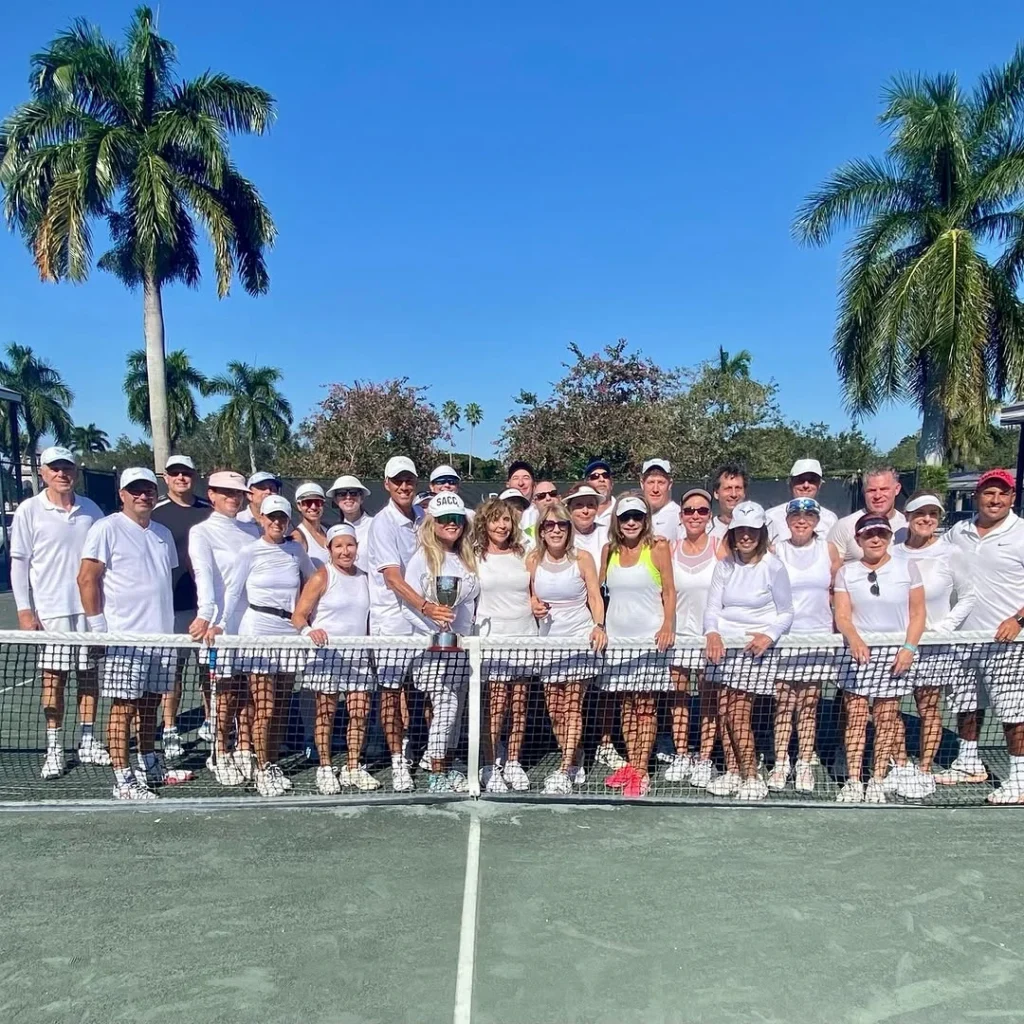 Members participating in a tennis social event at St. Andrews Country Club in Boca Raton Florida
