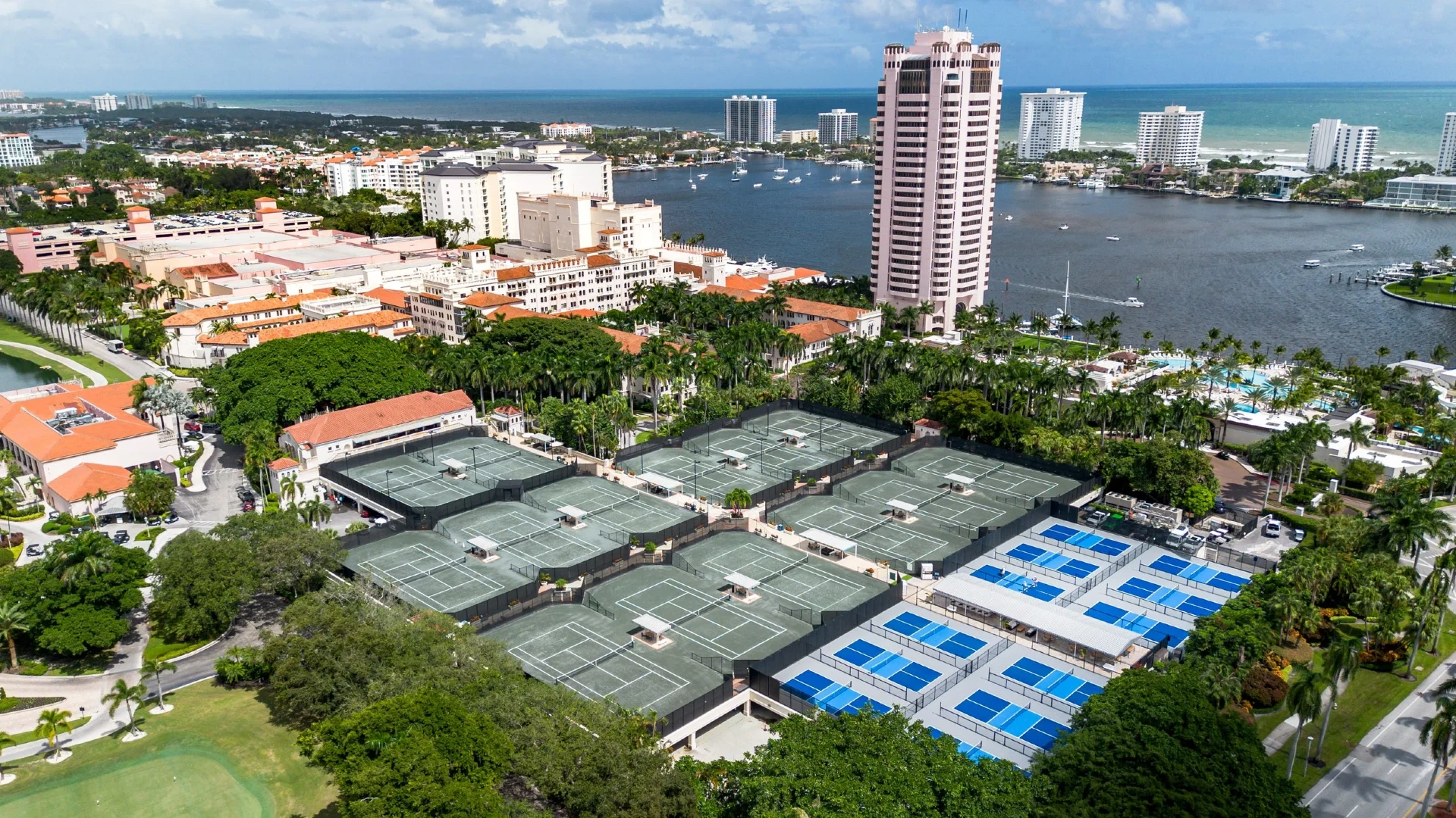 Aerial view of The Racquet Club at The Boca Raton featuring HydroGrid tennis courts, pickleball courts, and luxury resort amenities