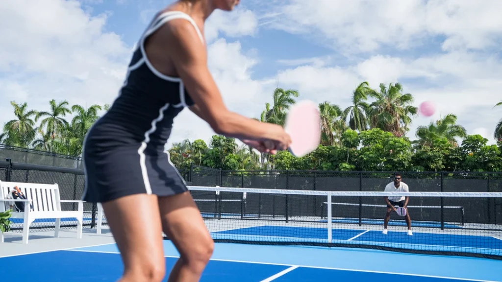 Players competing on pickleball courts at The Racquet Club at The Boca Raton