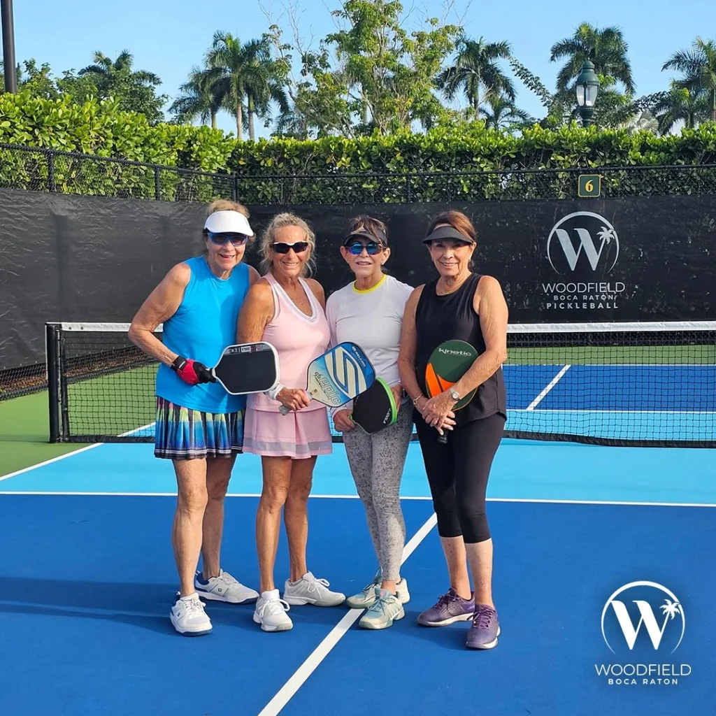 Residents playing pickleball at Woodfield Country Club in Boca Raton