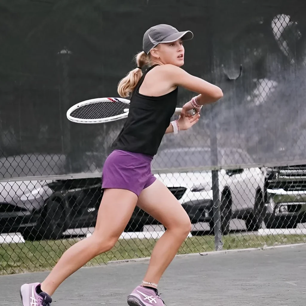 Junior player practicing a backhand during training at Axis Tennis Academy