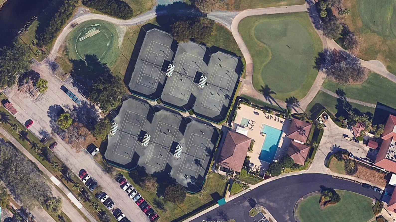 Aerial view of the six Har-Tru tennis courts at Bear Lakes Country Club in West Palm Beach Florida