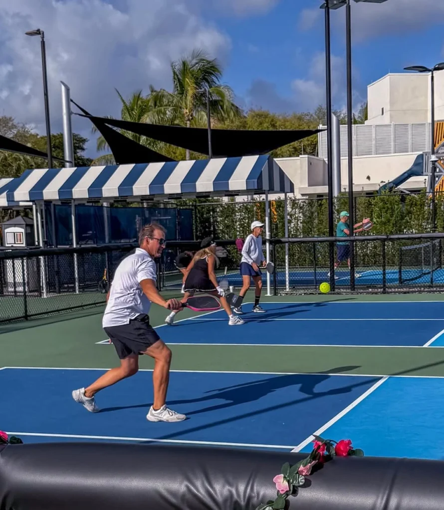 Members playing pickleball at Boca Grove's dedicated pickleball facility.