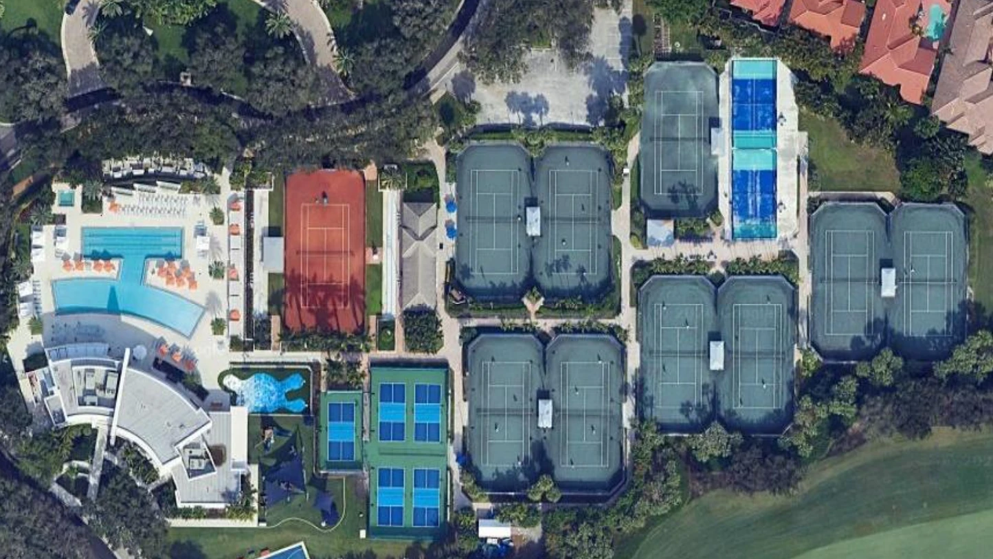 Aerial view of the Boca Grove Racquet Center featuring Har-Tru tennis courts, pickleball courts, padel courts and the Italian red clay stadium court.