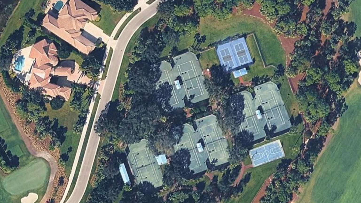 Aerial view of the Breakers West Country Club tennis complex and surrounding golf community in West Palm Beach