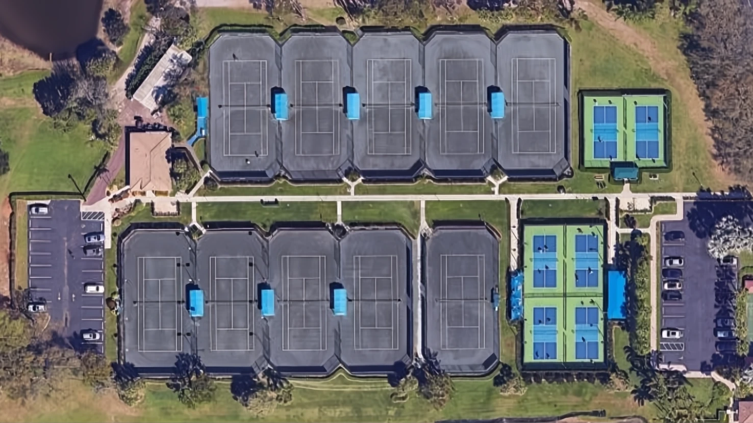 Aerial view of the Coral Lakes racquet complex with 10 Har-Tru tennis courts and 6 pickleball courts in Boynton Beach