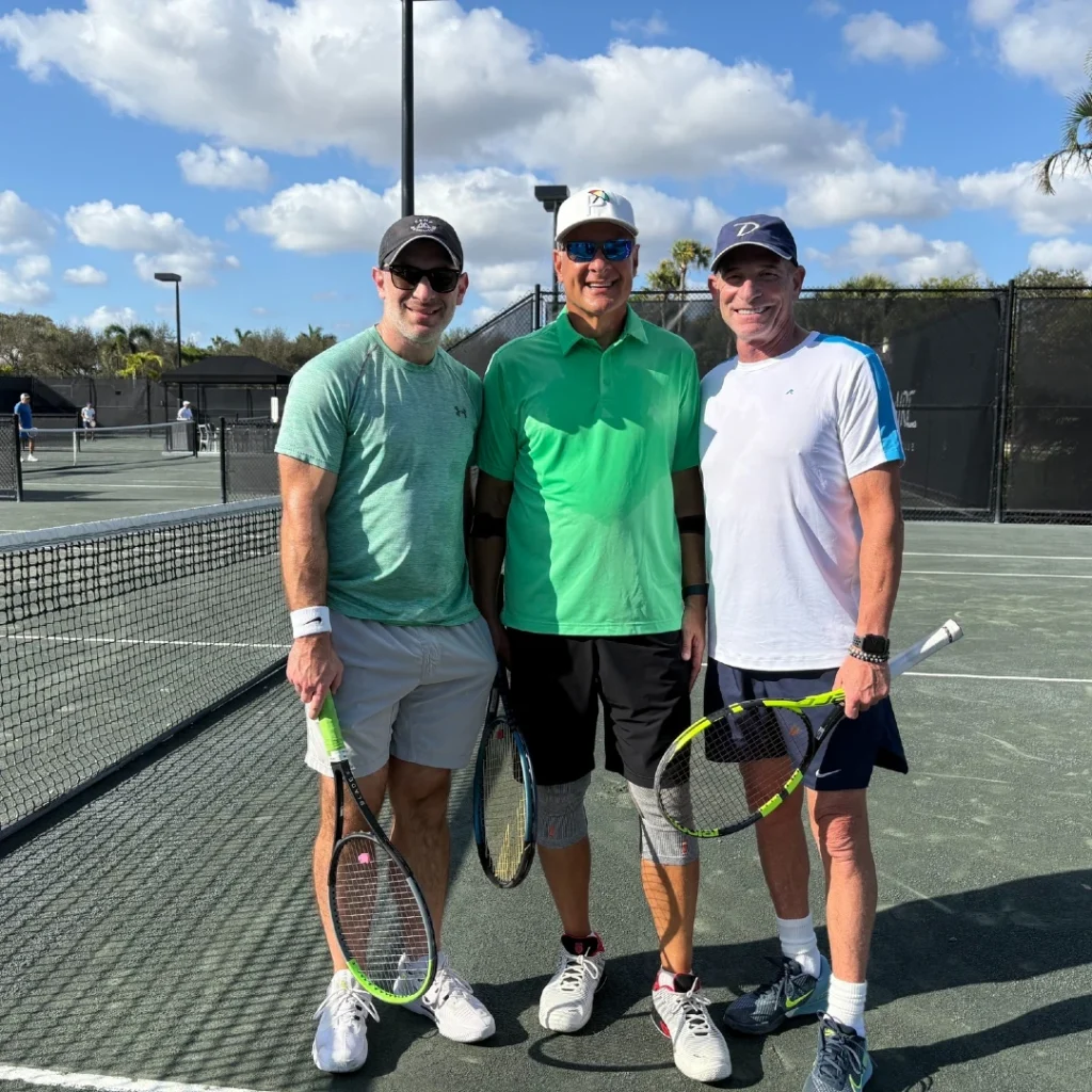 Three Delaire Country Club members with racquets