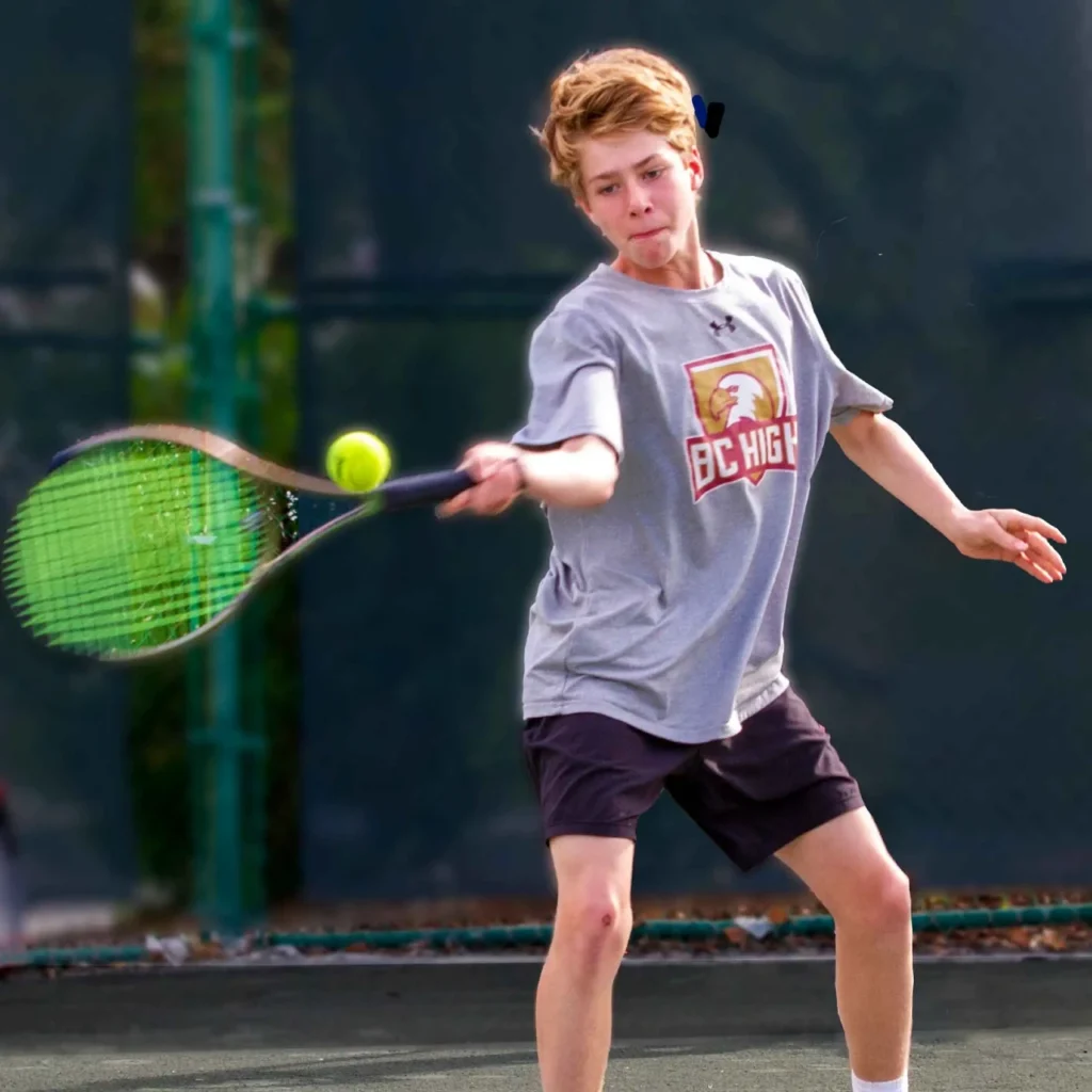 Junior player competing during high performance tennis training at Delray Beach Tennis Center