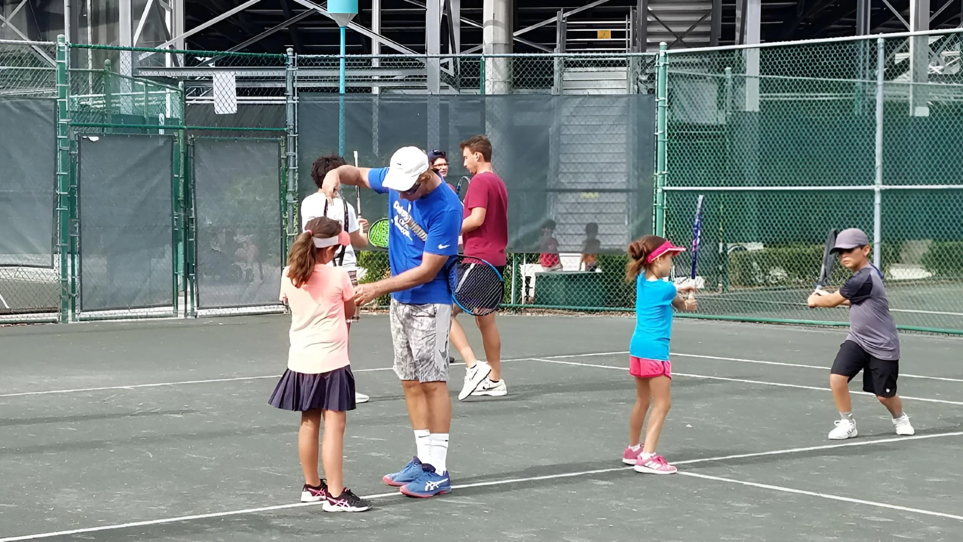 Youth tennis players participating in instructional programs at Delray Beach Tennis Center