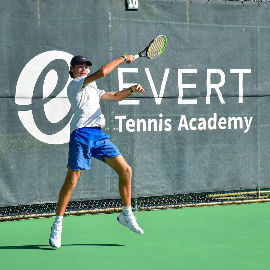 Junior tennis player practicing forehand technique at Evert Tennis Academy
