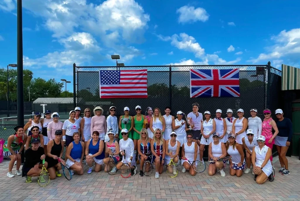 Frenchman's Reserve women's tennis group with American and British flags at team event