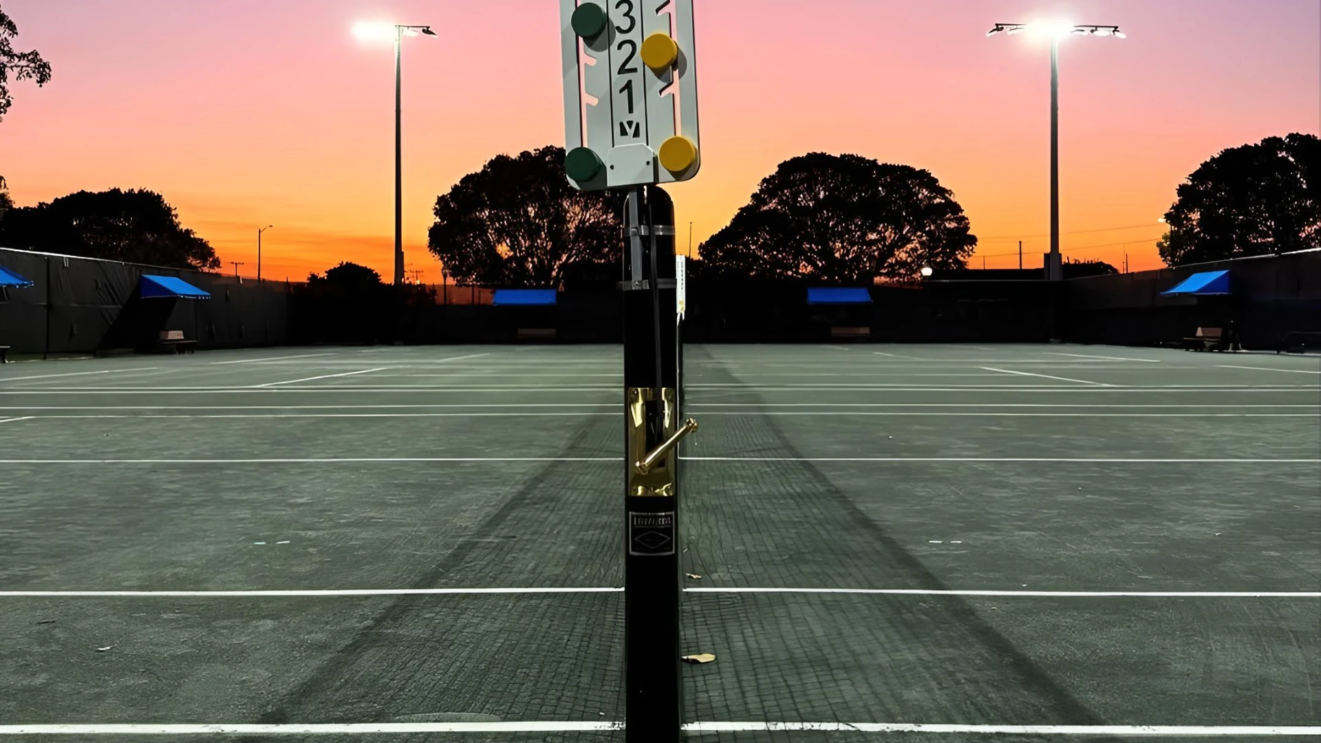 Har-Tru tennis courts at Howard Park Tennis & Pickleball Center during sunset in West Palm Beach