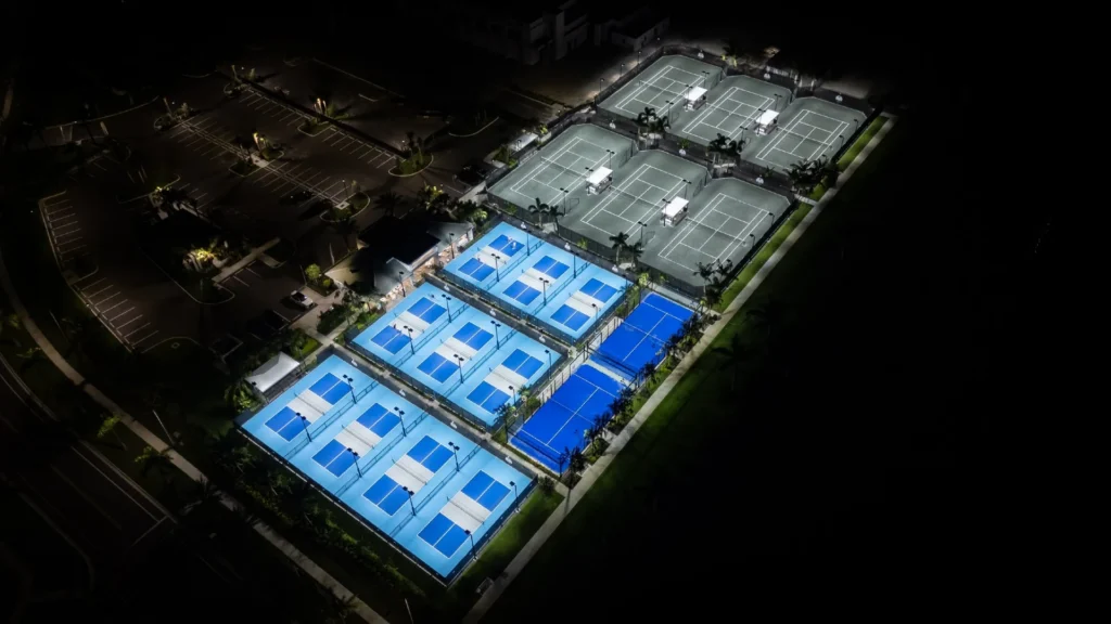Aerial night view of Lotus Edge tennis and pickleball courts in Boca Raton