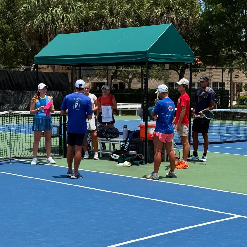 Players and coaches during a training session at One Tennis Academy