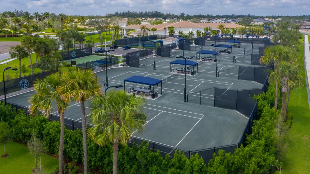 Aerial view of Polo Trace Racquet Club featuring Har-Tru tennis courts, pickleball courts, and clubhouse amenities in Delray Beach