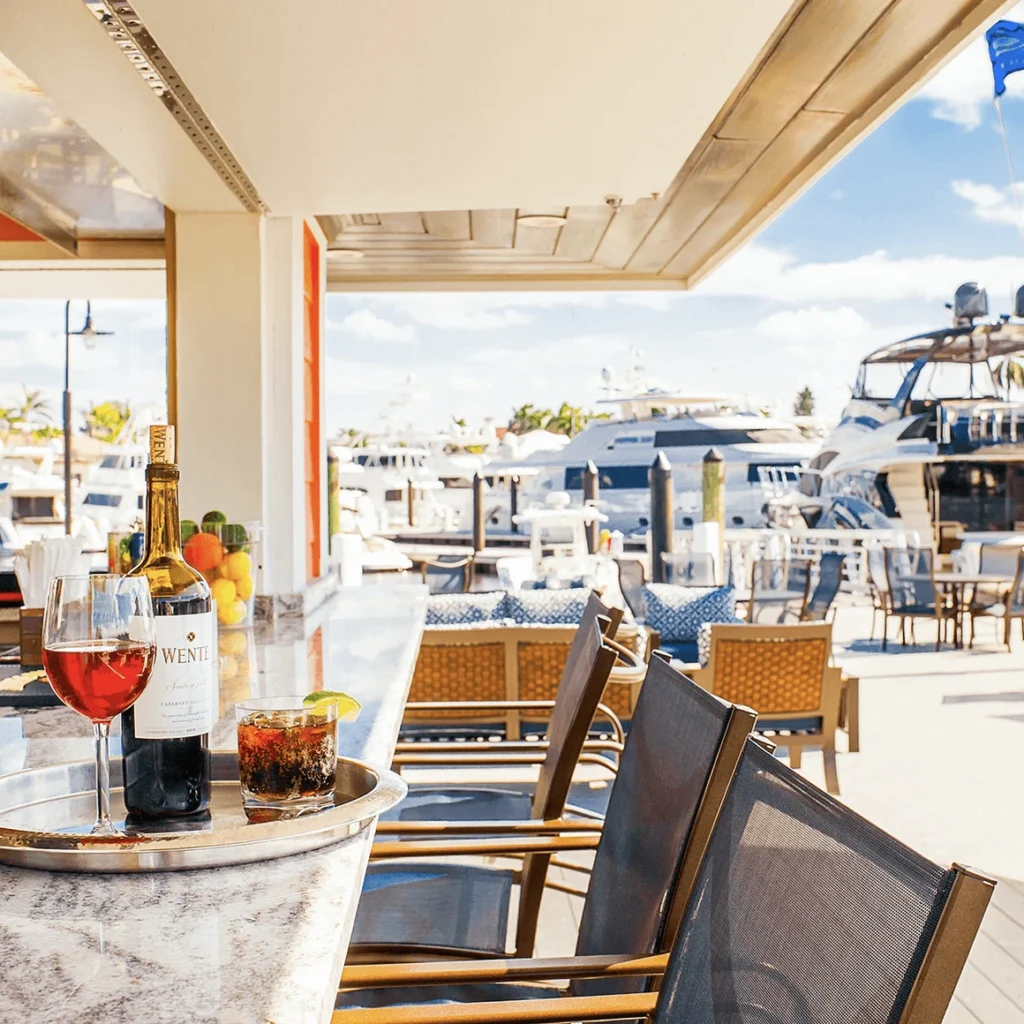 Waterfront bar with wine and cocktails overlooking the yacht marina at Royal Palm Yacht and Country Club