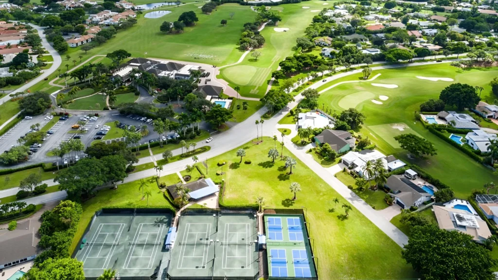 Aerial view of The Seagate Country Club tennis complex, clubhouse and surrounding homes in Delray Beach