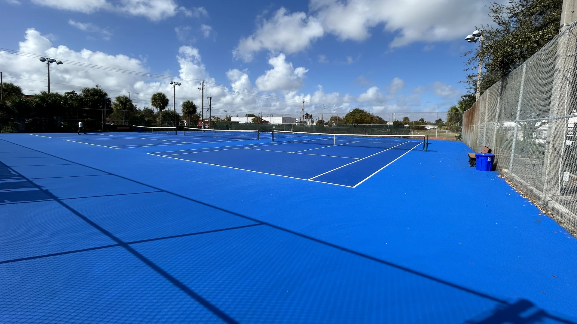 Blue hard courts at South Olive Tennis Center in West Palm Beach
