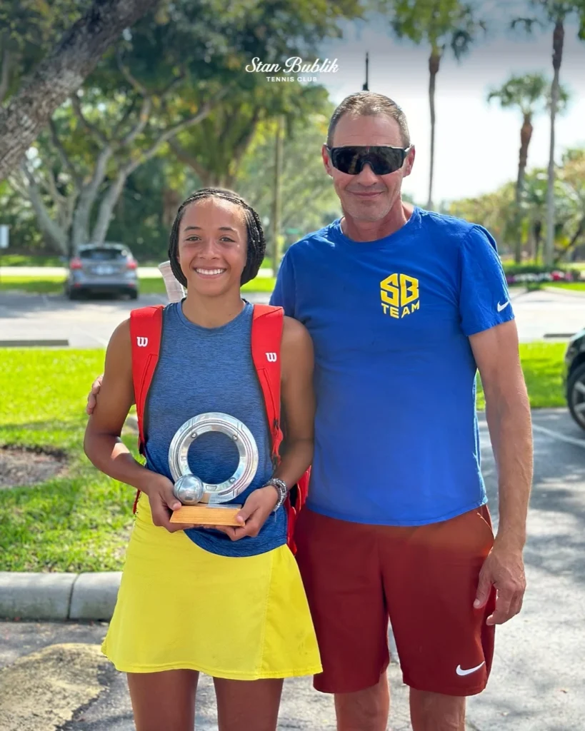 Stan Bublik with junior player after tournament championship victory