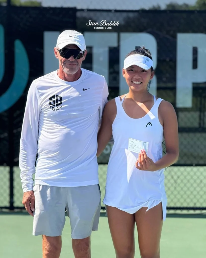 Stan Bublik with academy player receiving college tennis scholarship support