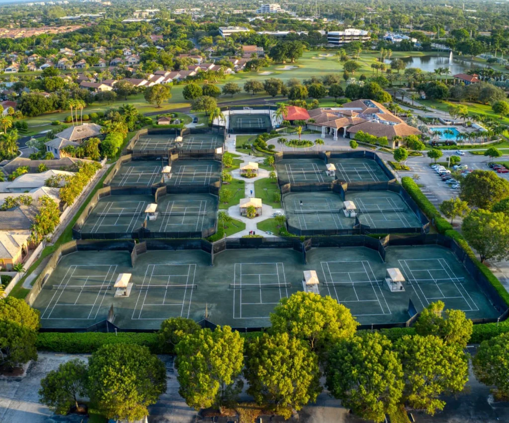 Aerial view of The Club at Boca Pointe Sports Center, tennis courts, pool, and clubhouse