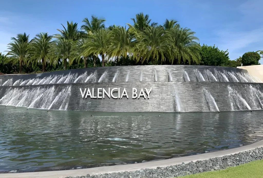 Valencia Bay entrance waterfall and monument sign in Boynton Beach, Florida.