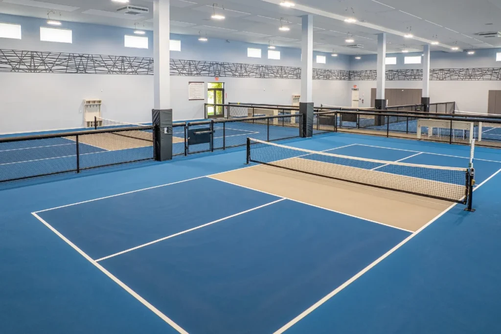 Climate-controlled indoor pickleball courts at Valencia Del Mar in Boynton Beach.