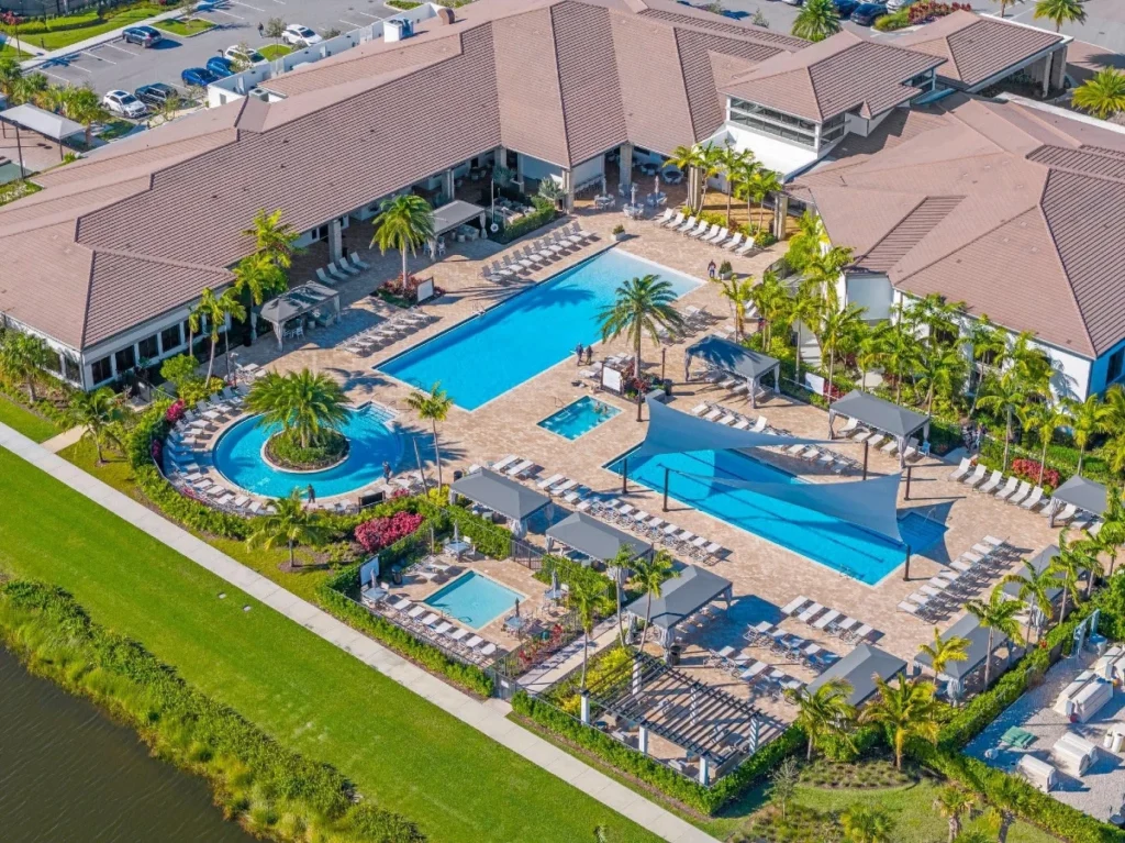 Resort-style swimming pools and clubhouse at Valencia Grand in Boynton Beach.